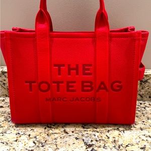 Marc Jacobs leather “The tote” size medium. Smoke free home.